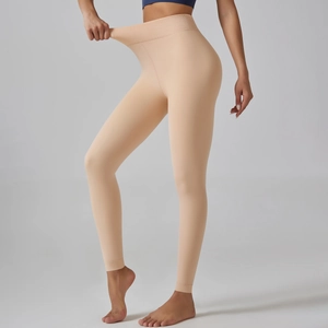 Close-up showing the high elasticity and ribbed high waistband of the thermal leggings