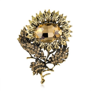 Detail of vintage sunflower brooch with champagne gemstones and bronze metallic finish