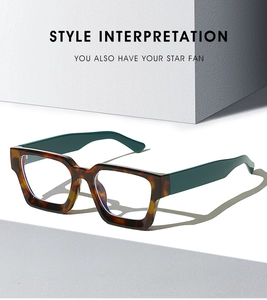 Detail of tortoise frame and green temples of trendy blue light blocking square glasses