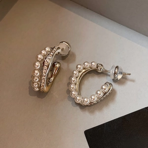 Elegant gold C-shaped earrings with pearls and crystals for a sophisticated vintage look