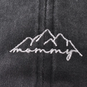 Washed dark gray baseball cap with white mountain and mommy embroidery detail
