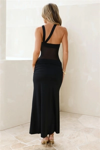 Detail of asymmetrical shoulder and mesh patchwork on back of black bodycon dress