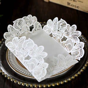 Detailed laser cut floral wedding invitation cover on a luxury decorative glass tray