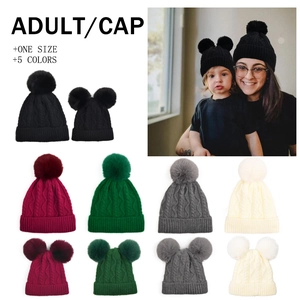 Matching parent-child knit beanies with fluffy pom poms in five assorted winter colors
