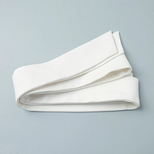 Macro detail of the high-density white cotton fabric texture and weave of the belt strap