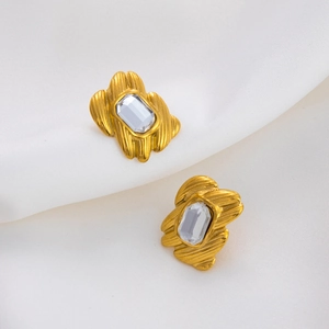 Macro shot of rectangular crystal zircon with 18K gold-plated vintage metal texture