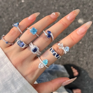 Elegant S925 sterling silver rings with blue heart and square zircon stones on fingers