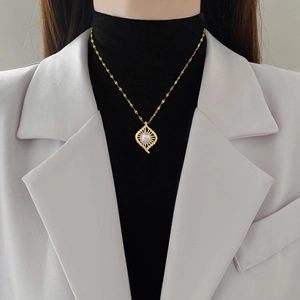 Luxurious gold titanium bird nest necklace with mermaid pearl and zircon pendant