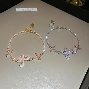 Pink crystal butterfly bracelet in gold and silver finish with sparkling zircon stones