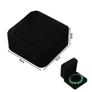 Detailed view of black velvet jewelry box with 9x9x4cm size dimensions and inner padding