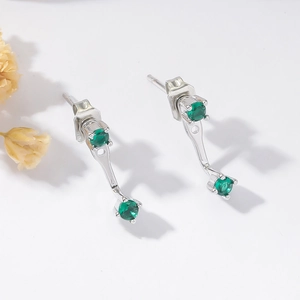 Elegant silver stud earrings with 14K gold plating and sparkling green zircon stones