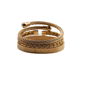 Three-piece gold-tone stainless steel bracelet set with twisted wire and Roman numerals