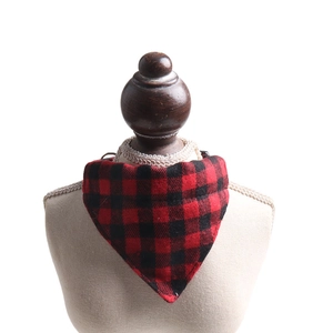 Close-up of red and black buffalo plaid pet bandana on a small pet mannequin