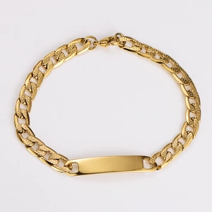 Detailed view of golden Cuban link chain with textured engraving and blank customizable bar