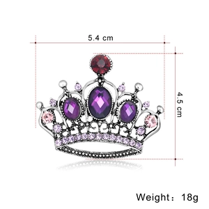 Luxurious silver crown brooch with purple crystals and dimensions shown on white background