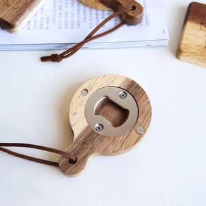 Acacia wood magnetic beer bottle opener with natural grain and leather hanging strap
