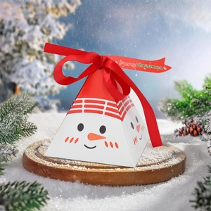 Pyramid-shaped Christmas snowman gift box with red ribbon on rustic wooden stand