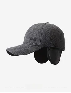 Detail view of winter baseball cap with ear flaps and SPORT leather patch
