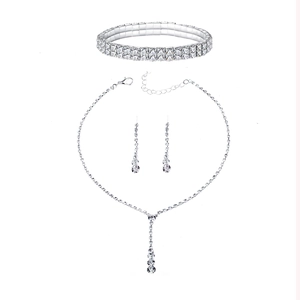 Silver bridal jewelry set featuring rhinestone necklace, drop earrings and bracelet