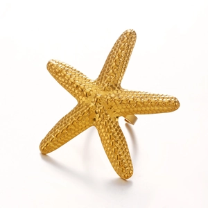 Golden starfish ring with textured surface and open adjustable band for beach style