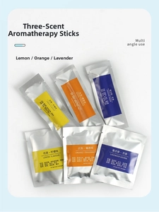 Detailed view of individual lemon, orange, and lavender scent sticks in foil packaging