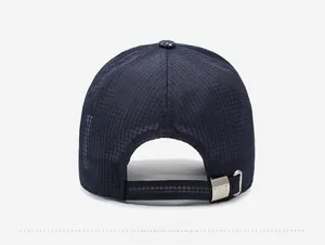 Detail of adjustable metal buckle and breathable mesh on navy blue baseball cap