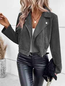 Detail of dark grey faux suede biker jacket with lapel collar and zipper pockets