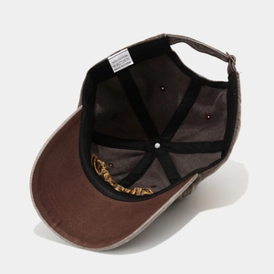Internal view of brown washed cotton baseball cap with metal buckle and inner stitching