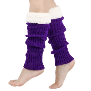 Close-up of purple cable knit leg warmers with white faux fur trim on model's legs