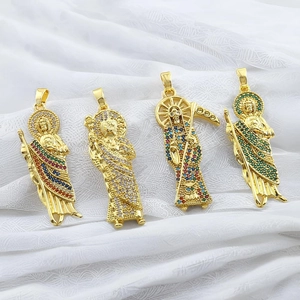 Macro detail of four religious St. Jude pendants with colorful micro-inlaid zircon crystals