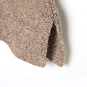 Minimalist heather brown knit sweater featuring a soft wool texture and side vent hem