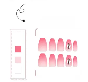 Detailed view of pink gradient press-on nails with shiny diamond rhinestone accents