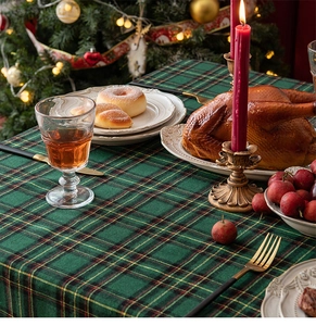 Detailed texture of green plaid cotton linen Christmas table runner with festive decor