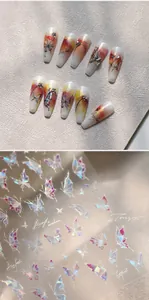 Macro detail of M-875 laser butterfly nail art stickers with iridescent gold foil finish