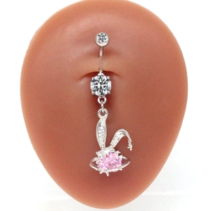 Silver rabbit belly button ring with pink heart zircon on a silicone model body