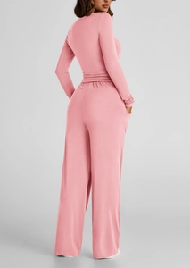 Rear view of pink long sleeve knit set with high-waisted wide-leg pants for women