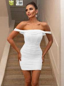 Detail of a white off-shoulder bodycon mini dress with elegant ruched fabric details