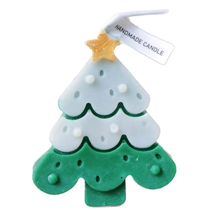 Green and white layered Christmas tree scented candle with gold star and handmade tag