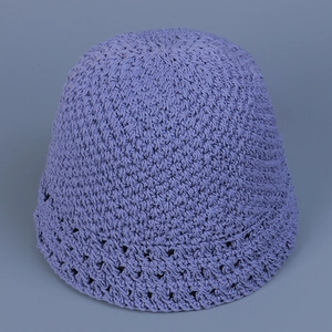 Detail of light purple hand-crocheted bucket hat with hollow diamond pattern textures