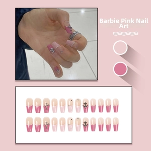 French tip press-on nails in Barbie pink with chrome heart silver cross and rhinestones