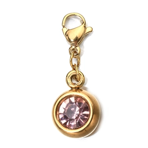 Detailed close-up of 6mm pink round cubic zirconia charm with gold lobster clasp