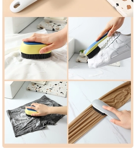 Close-up of long handle multi-purpose cleaning brush scrubbing white shoes and fabric