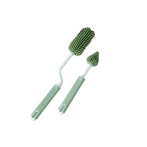 Silicone baby bottle and nipple cleaning set with mint green ergonomic handles