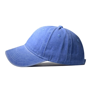 Detail of washed cotton baseball cap with white contrast stitching and six-panel structure