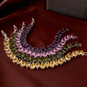 Luxury pear-cut crystal bracelets in yellow, green, pink, and purple with silver clasps
