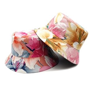 Women's reversible floral sun hat with vibrant summer flower prints on cotton bucket hat