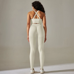 Back view of cream white seamless yoga set with cross-back bra and high-waist leggings