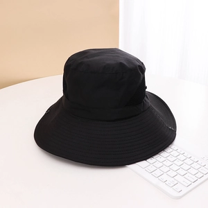 Detail view of black outdoor sun hat featuring breathable side mesh and wide brim design