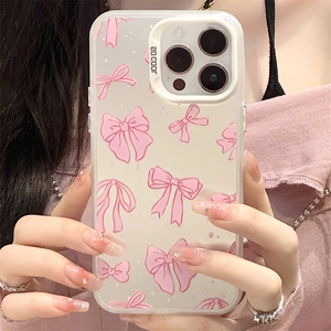 Macro shot of a clear phone case featuring a pink bow pattern and SO COOL camera frame