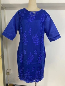 Detail of royal blue mid-sleeve dress featuring intricate floral embroidery and satin finish